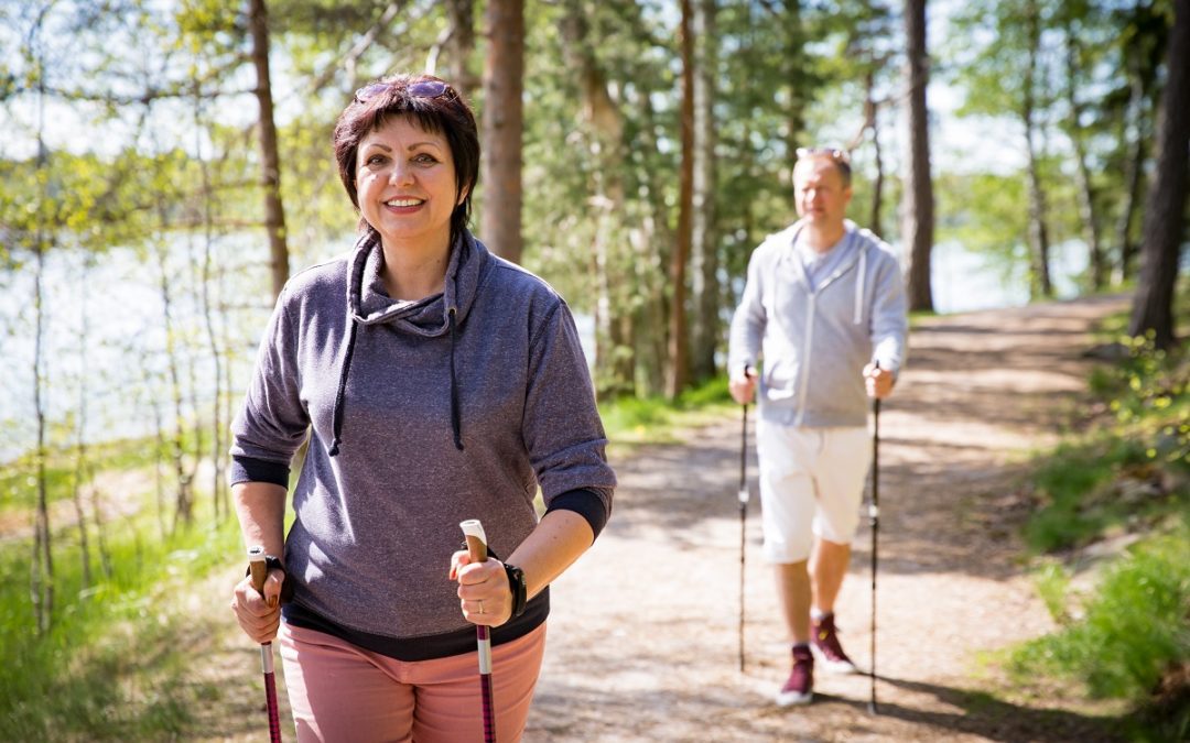 Mature couple walking side by side on hike