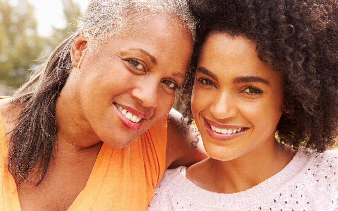 Beautiful african american mother and daughter posing together